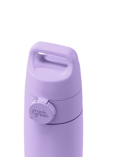Close-up of a lavender Grip & Sip lid closed on a 12oz insulated bottle, showing the carry handle.
