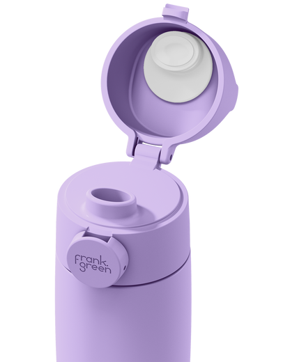 Close-up of a lavender Grip & Sip lid on a 12oz insulated bottle, with the sip cap flipped open to show the spout.