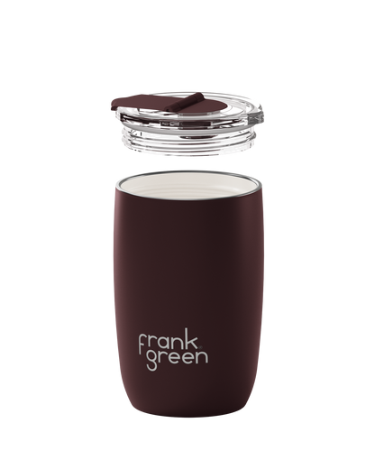A dark brown insulated travel tumbler with a clear lid and a small brown silicone straw cover, shown on a solid white background. The brand name 'frank green' is printed in white on the front.