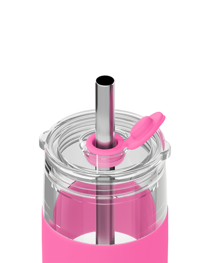 Close-up of a pink insulated tumbler with a clear lid, stainless steel straw, and bright pink silicone sleeve on a white background.