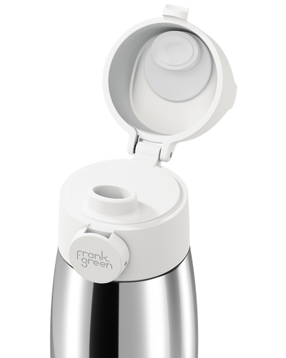 Close-up of a white grip handle lid flipped open on a polished stainless steel bottle, showing the white inner seal, drinking spout, and circular 'frank green' logo tab on a plain white background.