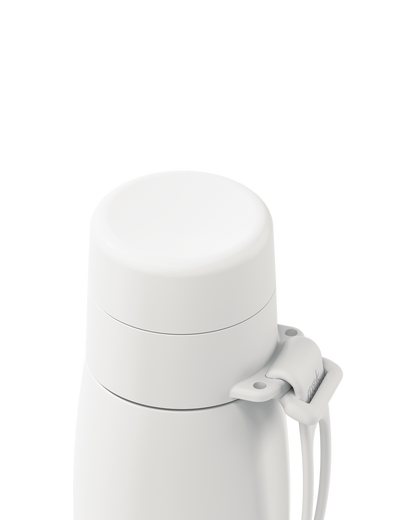 Close-up of a white thermal lid closed on a 20oz insulated bottle, with the carry loop attached.