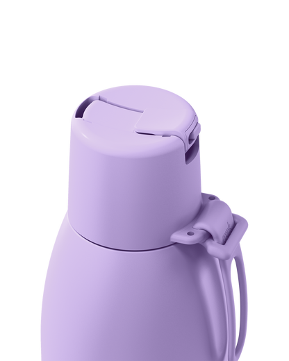A close-up of a matte lavender purple insulated bottle or thermos, showing the lid, handle, and clasp against a plain white background.