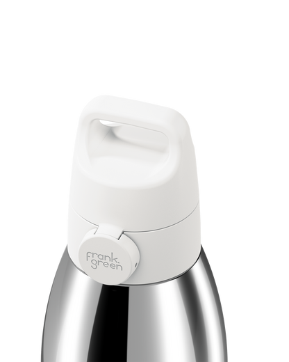 Close-up of a stainless steel water bottle with a white lid and a circular white logo plate reading 'frank green' on a white background.