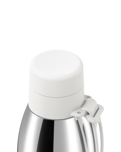 Close-up of a white thermal lid closed on a polished stainless steel 34oz insulated bottle, with the carry loop attached.